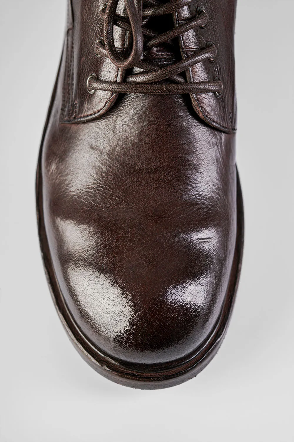 CURZON raw-timber military boots.