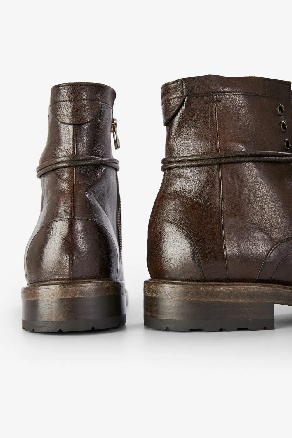 CURZON raw-timber military boots.